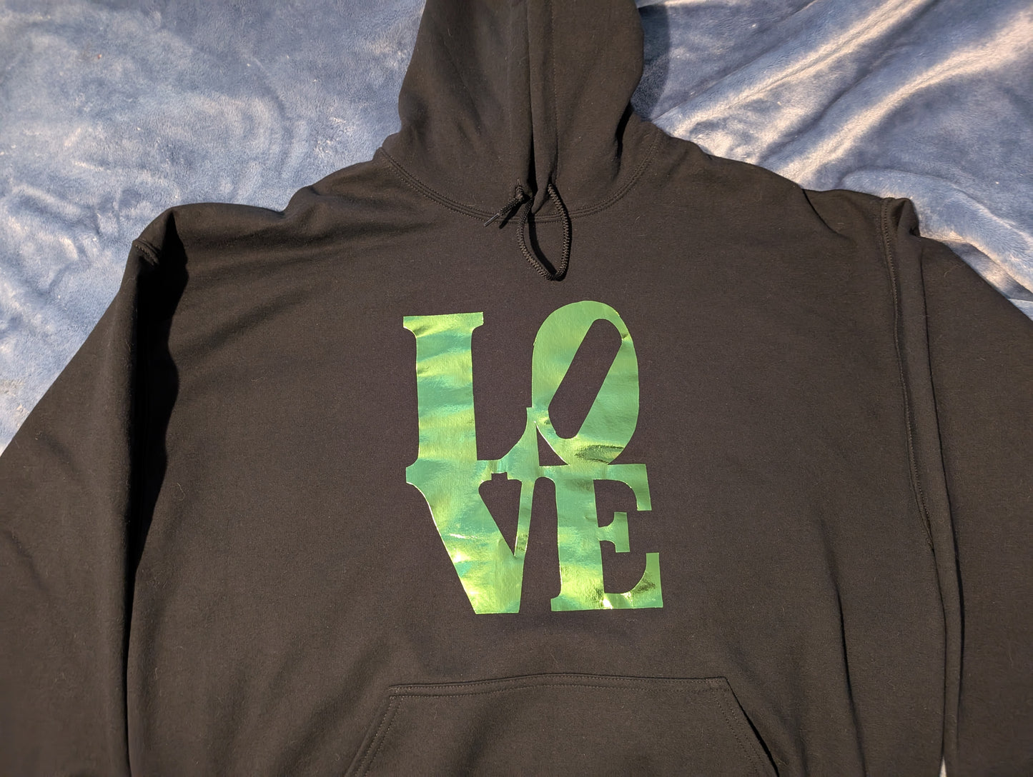 Black hoodie with reflective green LOVE writing