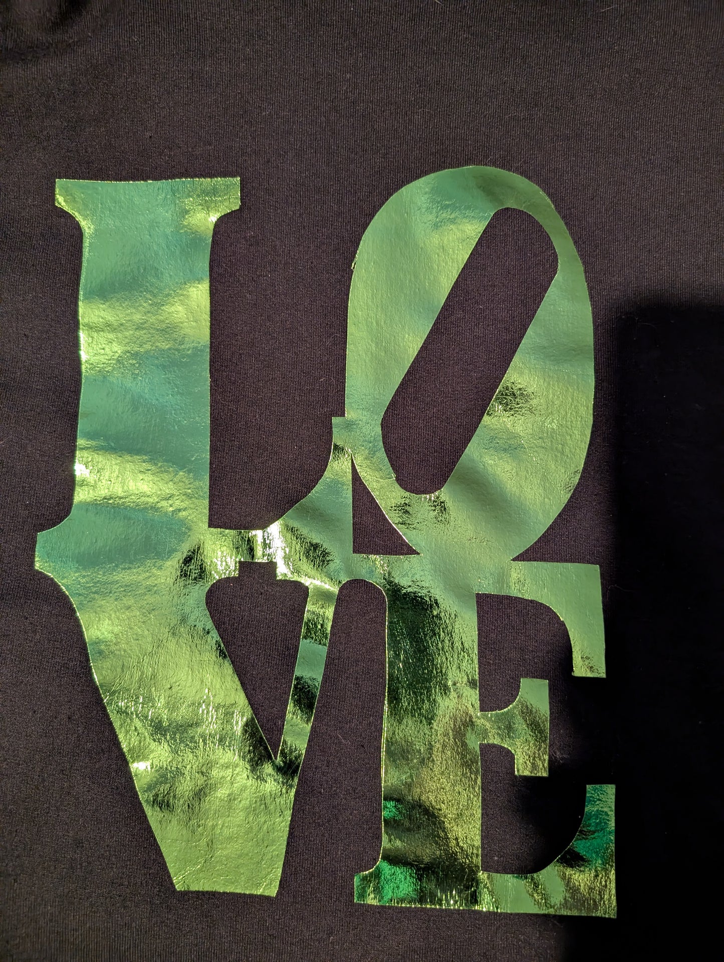 Black hoodie with reflective green LOVE writing