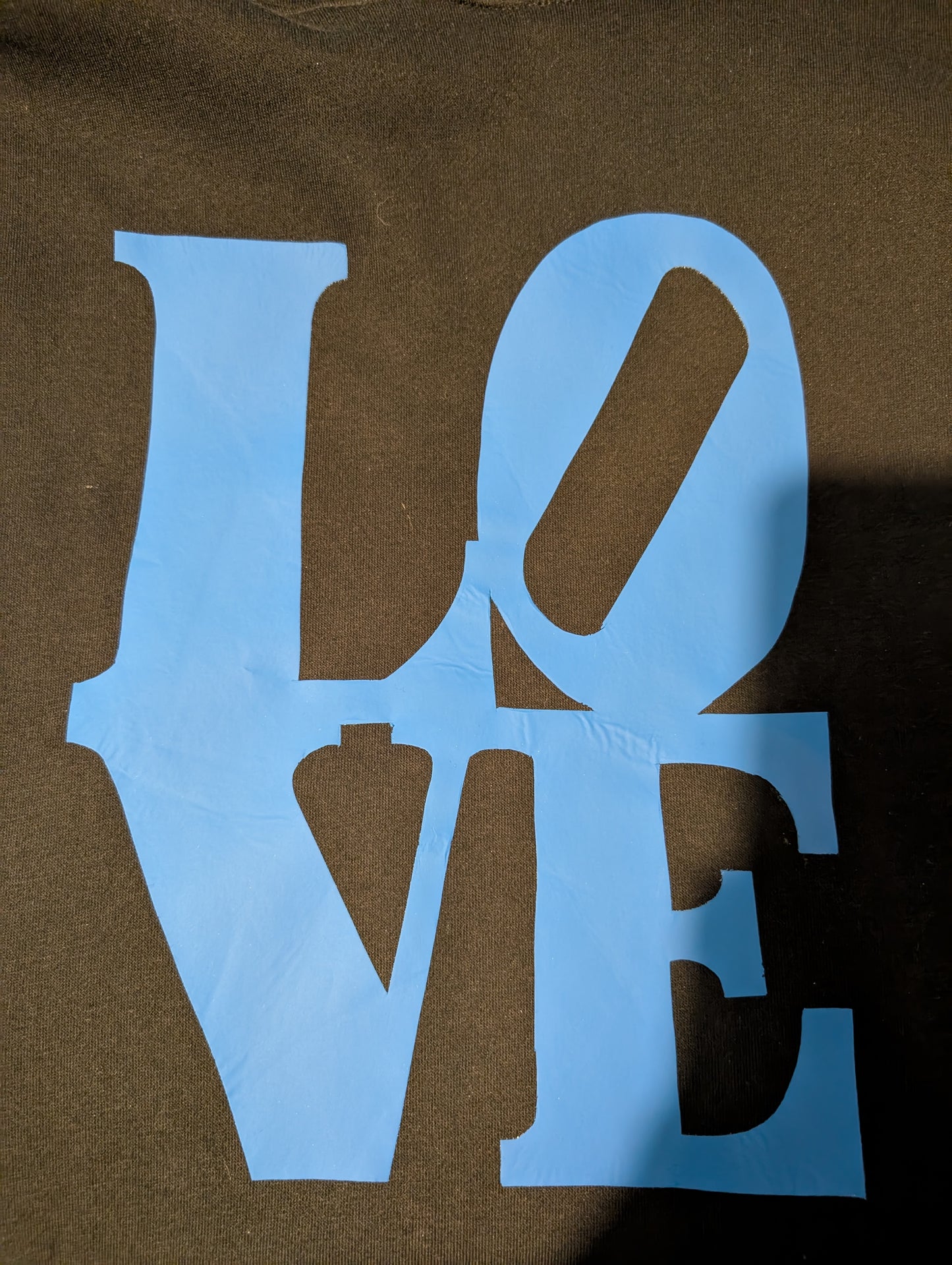 Black hoodie with light blue LOVE writing