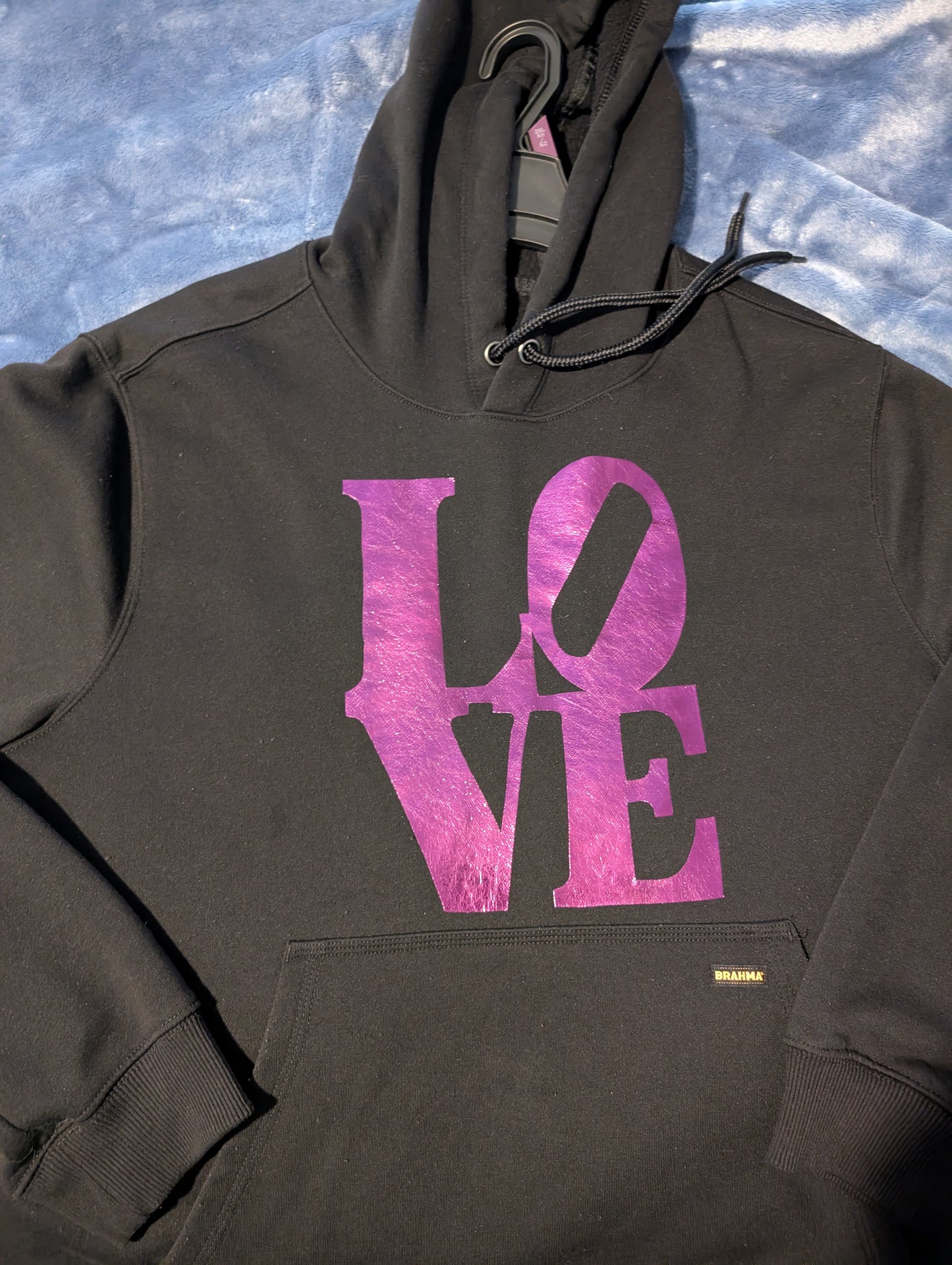 Black hoodie with purple reflective LOVE writing