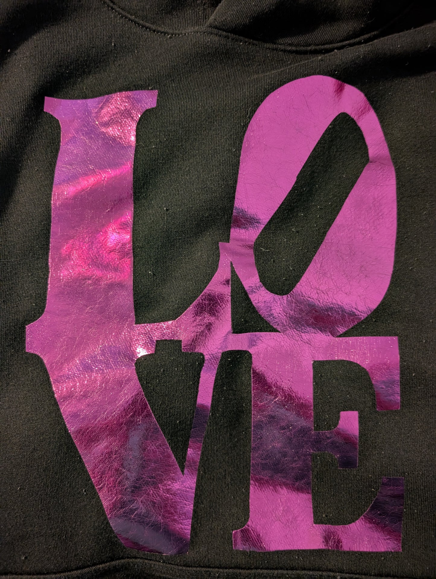 Black hoodie with purple reflective LOVE writing